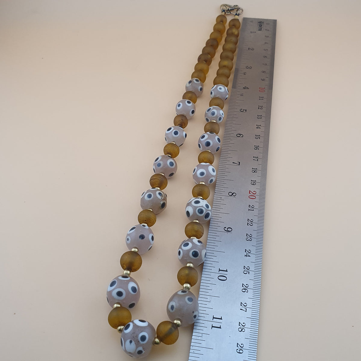 Collier de perles vénitiennes vintage, de style africain, en œil de moufette et verre jaune