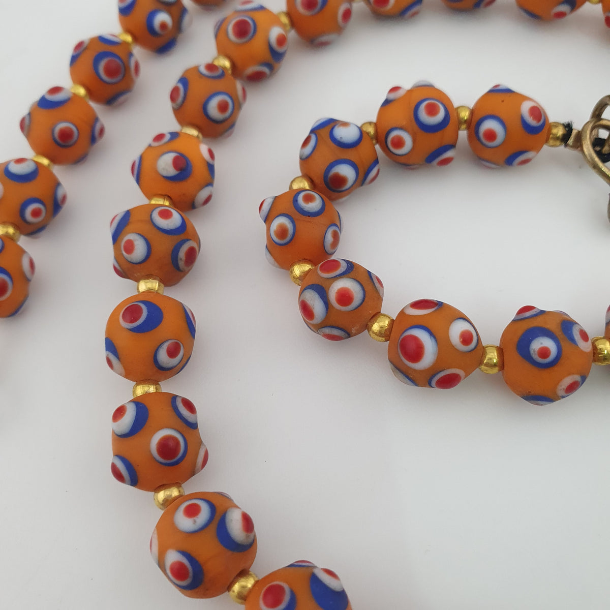 Collier de perles en verre orange style vénitien ancien, yeux de mouffette