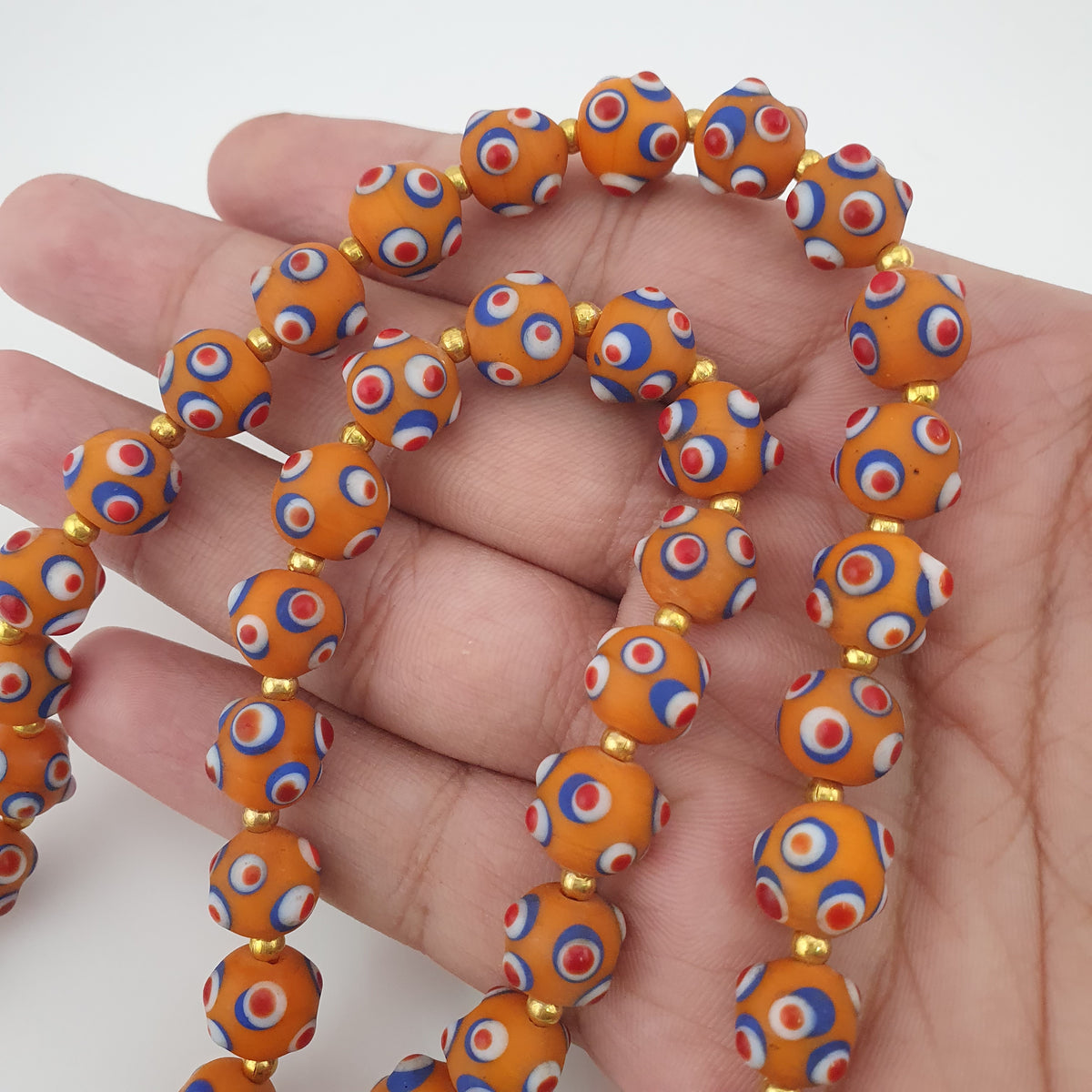 Collier de perles en verre orange style vénitien ancien, yeux de mouffette