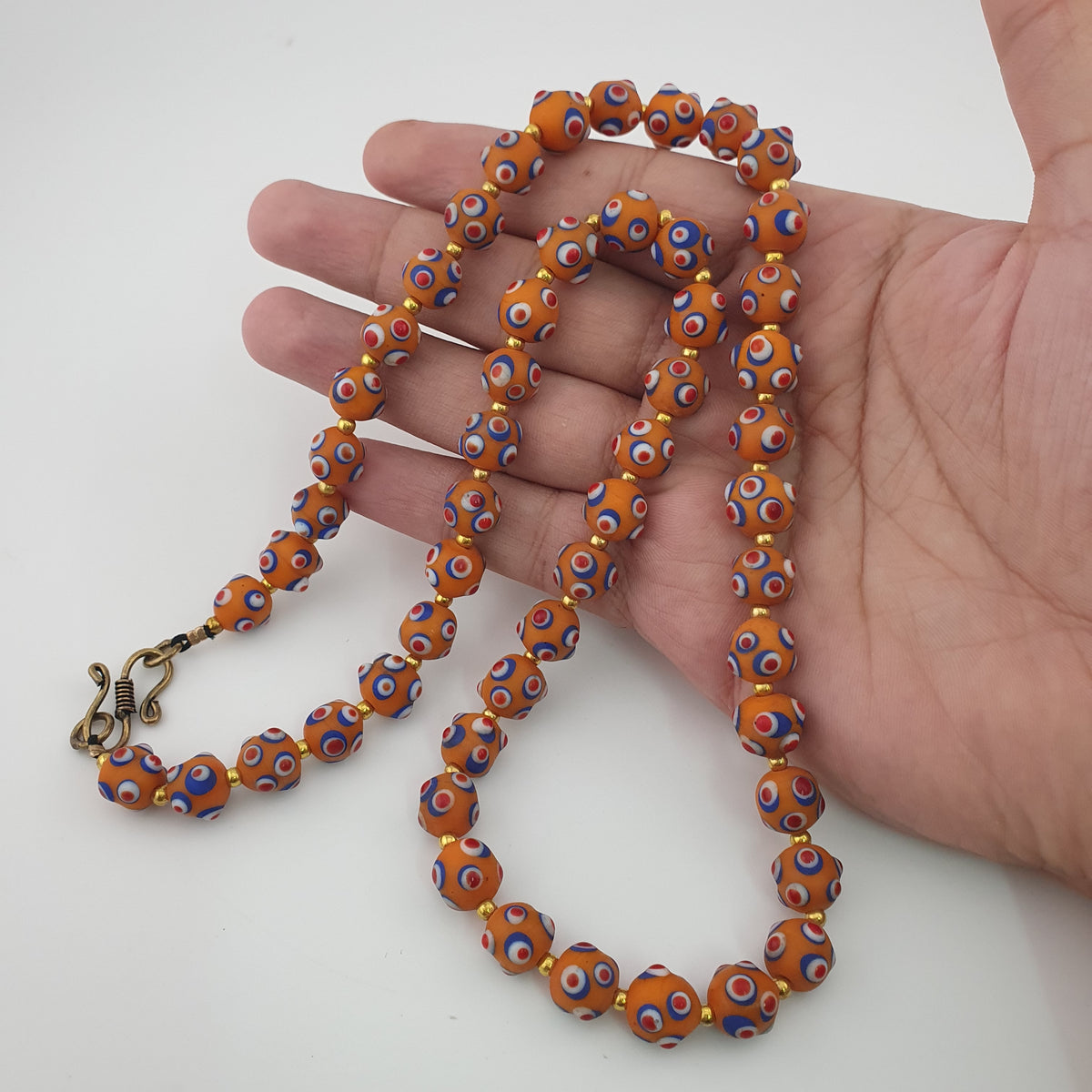 Collier de perles en verre orange style vénitien ancien, yeux de mouffette
