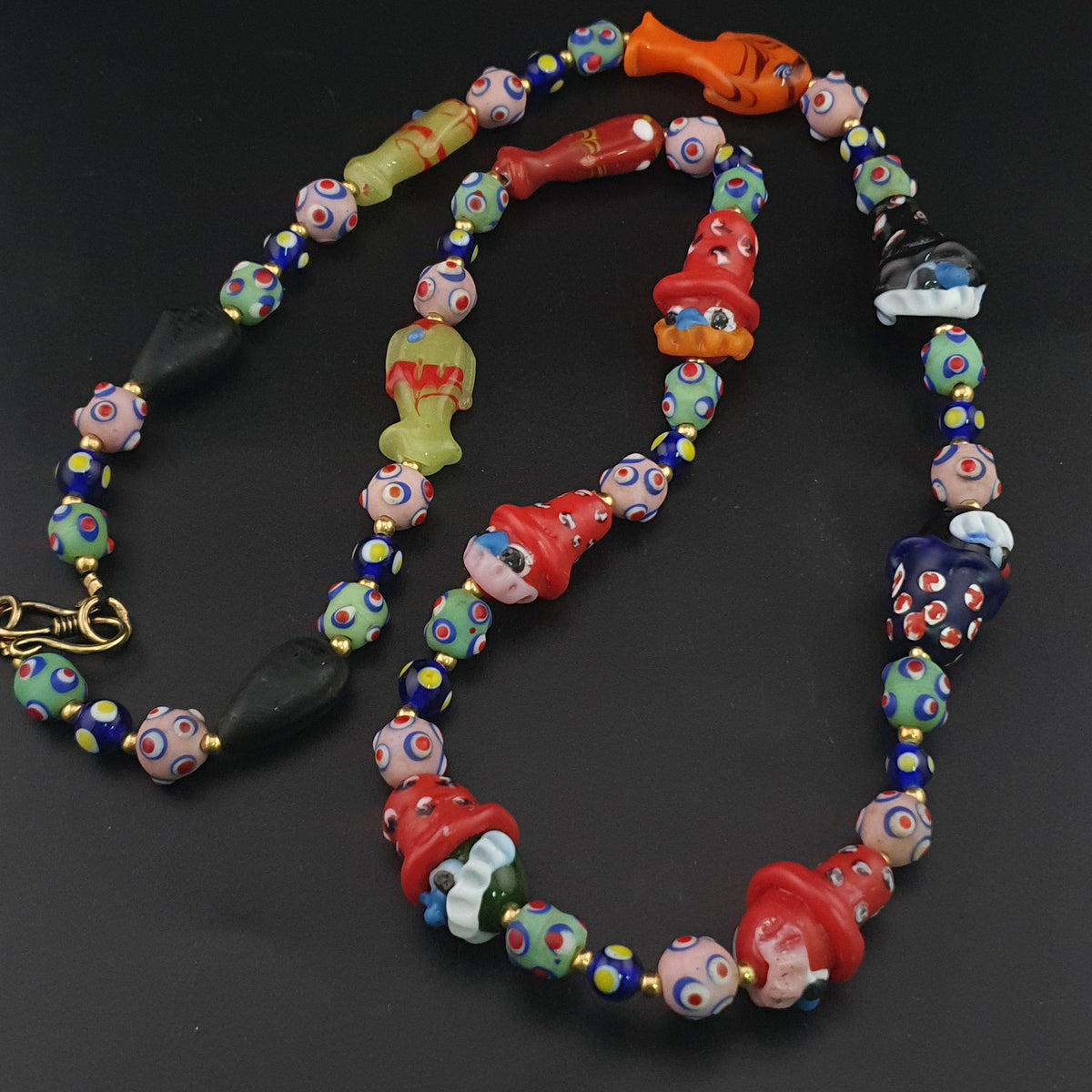 Collier de perles en verre vintage style vénitien avec yeux de mouffette et vieux visage